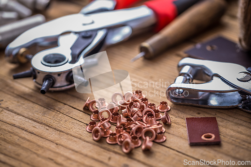 Image of Eyelet punch and rivets