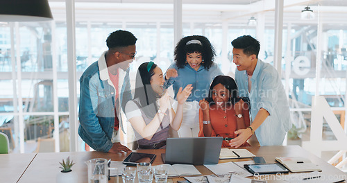 Image of Laptop, winner and a team high five while in celebration together of a goal, target or deal in the office. Applause, diversity and success with a man and woman employee group celebrating at work