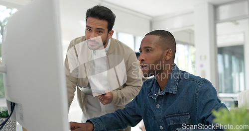 Image of Businessman, startup and coaching conversation at desk with tablet, computer and question for mentor in office. Black man, web design coach and learning in workplace for support, advice or teamwork