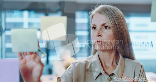 Image of Planning, sticky notes and marketing woman with a board writing information or research for a project. Analytics, creative and professional female employee from Canada working on advertising strategy