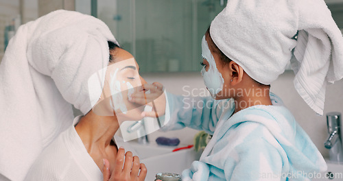 Image of Family, facial and mask with mother in bathroom with young child using hand to apply cosmetics. Wellness, black family and face cosmetic pamper treatment with kid and mama in happy home.