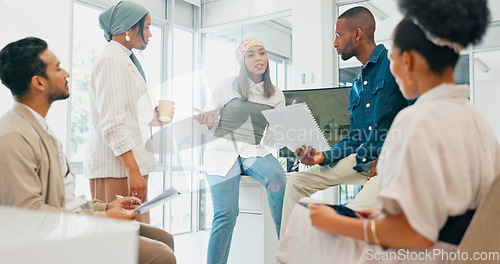 Image of Business woman, leadership or speaker in training, workshop or presentation in diversity growth, target or goals. Talking, mentor or presentation on paper, documents or tech in teamwork collaboration