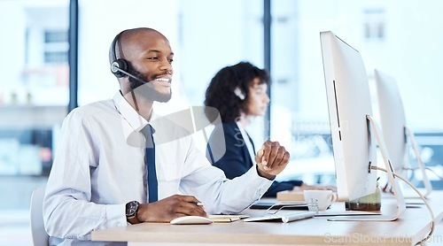 Image of Callcenter, customer service or black man on computer for customer support, consulting or networking in office. Manager, CRM or sales advisor on tech for telemarketing, research or contact us help