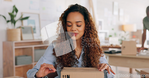 Image of E commerce, delivery and employee packaging box, product or stock for commercial distribution, courier shipping or export. Ecommerce, retail package and black woman working in supply chain industry