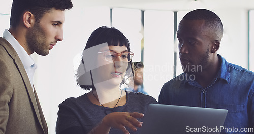 Image of Tablet, discussion and team of business people in the office doing research for a corporate project together. Collaboration, professional and group of employees working on a report on a mobile device