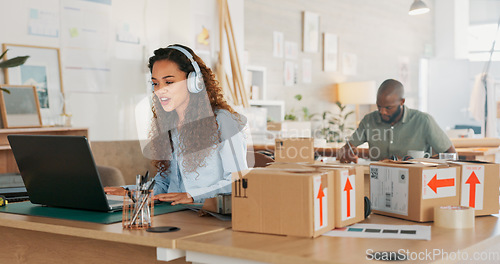 Image of Video call, customer service woman in a courier office for product consulting, sales negotiation or ecommerce. Logistics, customer support or business consultant laptop, headphones and shipping boxes