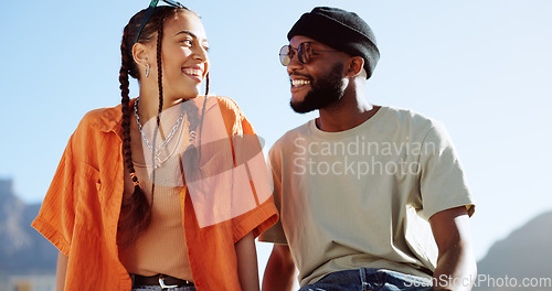 Image of Peace, love and couple in the city to relax, smile and be happy together in summer. Portrait of an urban and interracial man and woman with hand sign for communication and comedy against a blue sky