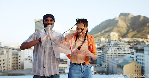 Image of African friends, dance and love smile laughing fun together on city building rooftop. Black American man, happy trendy woman and couple bonding or friendship spiritual freedom dance in urban town