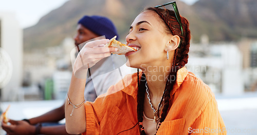 Image of Pizza, rooftop and friends eating outdoor with cityscape for urban, gen z and youth lifestyle food. Happy, relax and hungry black people or woman and man with fast food and city buildings location