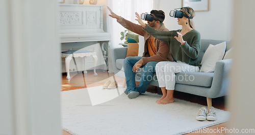 Image of VR gamer couple, metaverse or futuristic tech on sofa in living room for cyber game, 3D gaming or future ai media. Virtual reality, video game or esports for technology, digital fun or online fantasy