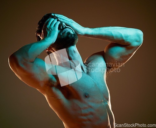 Image of Nude, body and dramatic with a muscular man in studio on a dark background for art or self expression. Fitness, naked and hands covering face with a male model posing for health, wellness or artwork