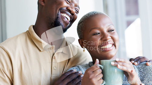 Image of Relax, love and couple hug with coffee drink break at window to enjoy while they bond together. Kind, caring and happy boyfriend giving black woman beverage with romantic embrace in home.