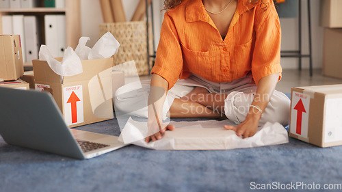 Image of Woman hands, wrap product and box package for shipping, ecommerce logistics and delivery in small business startup. Closeup entrepreneur, seller and client shipment, stock and packaging distribution