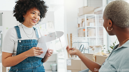 Image of Women, envelope and smile with handshake in deal at studio or business in home. Black woman, entrepreneur or designer get letter, document or paperwork, at office in house and say thank you to client