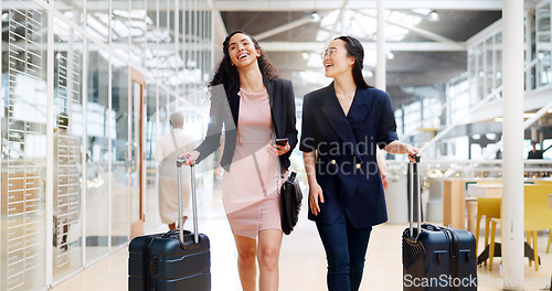 Image of Business woman, phone and walking with luggage in travel for work trip partnership at the workplace. Happy women talking or chatting on a walk to the airport for opportunity or journey with suitcase