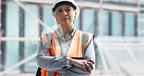 Image of Logistics, construction and architect working on management of a building at construction site. Portrait of a mature engineer in architecture with arms crossed during maintenance and industrial work