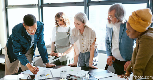 Image of Business people, tablet and teamwork for planning, strategy and ideas by desk in modern office for goal. Corporate group, digital tech and finance team for brainstorming, vision or target in New York