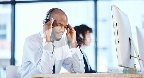 Image of Stress, anxiety and headache by consultant worker, customer service and call center employee in office. Pain, mental health and depressed telemarking agent overworked and frustrated at the workplace