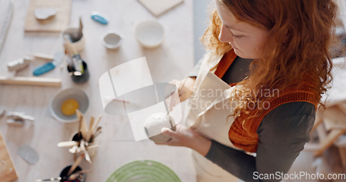 Image of Hands, pottery mud or sculpture artist with clay cup, mug or vase in art studio, product manufacturing workshop or small business. Top view, woman and sculpting tool in creative shop or ceramic class