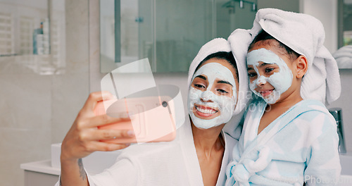 Image of Selfie, facial and family with a mother and daughter in the bathroom of their home together. Children, love and photograph with a woman and girl kid posing for a picture while bonding in the house