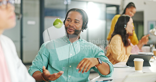 Image of Call center, consulting or black business man with apple on computer for telemarketing, customer service contact us. Communication, sales or crm employee at help desk with fruit for technical support