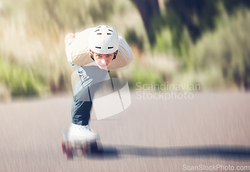 Image of Motion blur, skateboard and mock up with a man athlete training outdoor on an asphalt street at speed. Skating, fast and mock up with a sports male on a road for fun, freedom or adrenaline outside