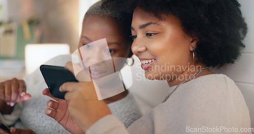 Image of Phone chat, web social media and friends happy in communication on the internet, search on mobile app and talking with technology on the sofa. Black women with smile for smartphone in the house