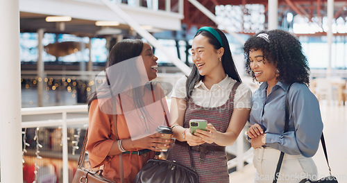 Image of Friends, smartphone and social media with women at shopping mall, meme and comedy with technology and communication on day out. Diversity, laugh and excited about comic online, phone and network.