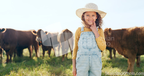 Image of Happy child, farming and fun learning to care for animals, cows and cattle during nature travel in countryside. Portrait of girl kid smiling and happy enjoying rural beef farm life and sustainability