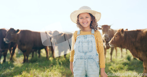 Image of Happy child, farming and fun learning to care for animals, cows and cattle during nature travel in countryside. Portrait of girl kid smiling and happy enjoying rural beef farm life and sustainability