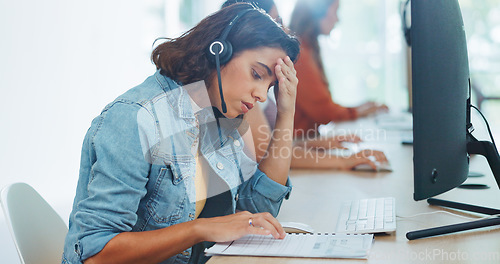 Image of Stress, headache and burnout woman at call center, feeling tired or exhausted. Mental health, anxiety or female sales agent, consultant or telemarketing employee with depression or migraine in office