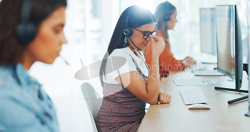 Image of Headache, stress and woman call center consultant working with a burnout in a coworking office. Migraine, frustrated and overworked female telemarketing agent consulting online for ecommerce sales.
