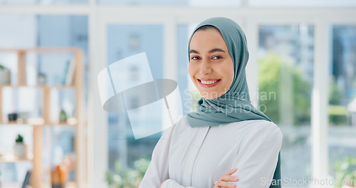 Image of Face, mindset and vision with a business muslim woman standing arms crossed in her office at work. Portrait, confidence and empowerment with an islamic female employee working on company growthFace,