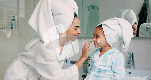 Image of Home spa, mother and child doing morning beauty cleaning with family product for dermatology, cosmetic and skincare. Black woman and girl happy for wellness, health and skin cream or mask in bathroom