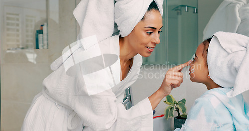 Image of Home spa, mother and child doing morning beauty cleaning with family product for dermatology, cosmetic and skincare. Black woman and girl happy for wellness, health and skin cream or mask in bathroom