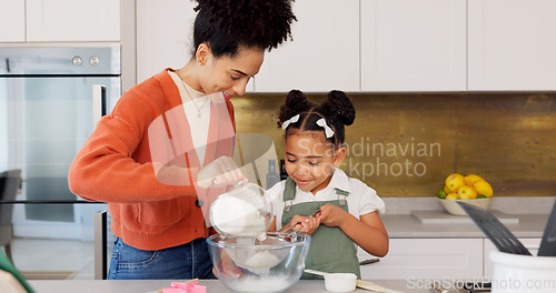 Image of Family, children and baking with a woman and girl cooking in the kitchen of their home together. Food, taste and love with a mother and daughter adding ingredients to a bowl while preparing a dessert