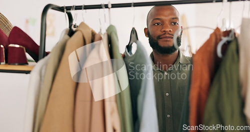 Image of Fashion, ecommerce and small business with man in warehouse for shipping, delivery and logistics. Supply chain, retail and online shopping with employee working in factory workshop for store product