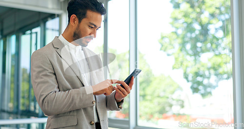 Image of Businessman, phone and office with celebration, happiness and motivation for good news, winning or promotion. Man, smartphone and winner for esports, stock market or crypto profit on web app at work