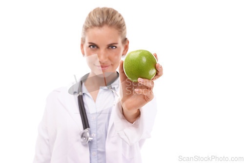 Image of Doctor, studio portrait and woman with apple for nutrition, wellness and health by white background. Happy isolated nutritionist, fruit and advice for healthcare, natural diet and healthy food