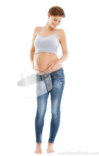 Image of Body of a pregnant woman in studio on a white background happy with pregnancy health, growth and development. Healthcare, wellness and an excited mother, hand holding stomach with advertising mockup