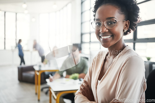 Image of Portrait, business and black woman arms crossed in office, smile and confident entrepreneur, coworkers and achievement. Nigerian female, leader and employee with happiness, corporate deal and target