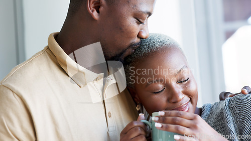 Image of Relax, love and couple hug with coffee drink break at window to enjoy while they bond together. Kind, caring and happy boyfriend giving black woman beverage with romantic embrace in home.