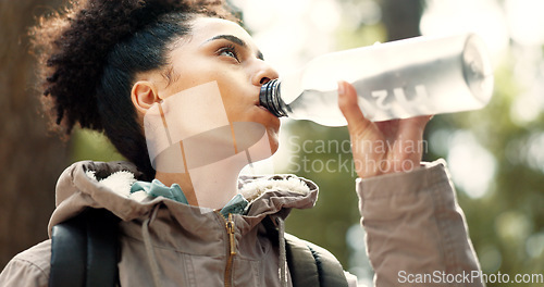 Image of Water, hiking and woman in nature for fitness, exercise and travel in mountains of Portugal. Training, adventure and girl trekking through forest or woods for adventure, health and cardio with drink