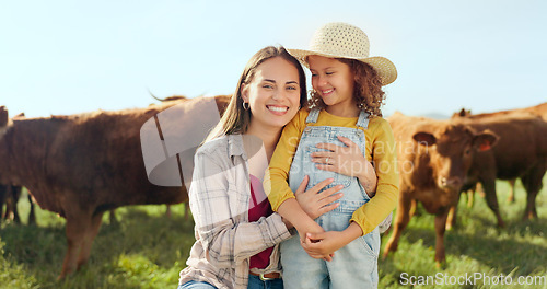 Image of Farming, child and mother with kiss on a farm during holiday in Spain for sustainability with cattle. Portrait of happy, smile and travel mom and girl with love while on vacation on land with cows