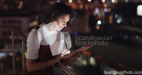 Image of Startup, data analysis or business woman on tablet at night on office balcony for communication, networking or social media. Rooftop, creative or girl with tech for 5g network, search or web review