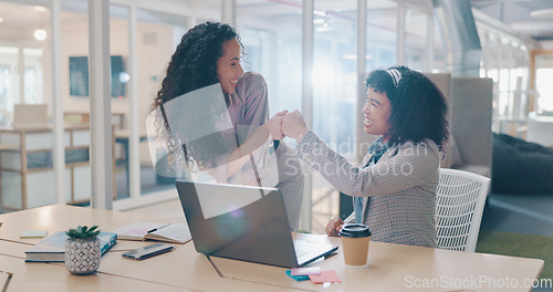 Image of Teamwork, laptop and business people fist bump, applause and success celebration. Coaching, training and friends, women or coworkers, clapping and celebrate after solving problem in office workplace.