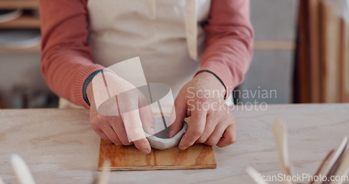 Image of Pottery, clay bowl and craftsman hands in artist studio, workshop and small business of creative product manufacturing. Ceramic designer, artisan and sculpture skill, mold shape and handmade process