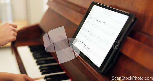 Image of Girl, piano and tablet with teacher for learning, education or training with tech for music in home. Child, keyboard and mom for development, teaching and theory for art, harmony or time on web