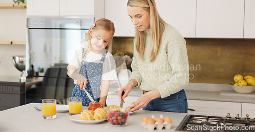Image of Breakfast, morning and mother and kid cooking, help or prepare croissant meal, fruit or food in home kitchen. Love, happy family and youth girl with mom, mama or woman enjoy fun quality time and bond