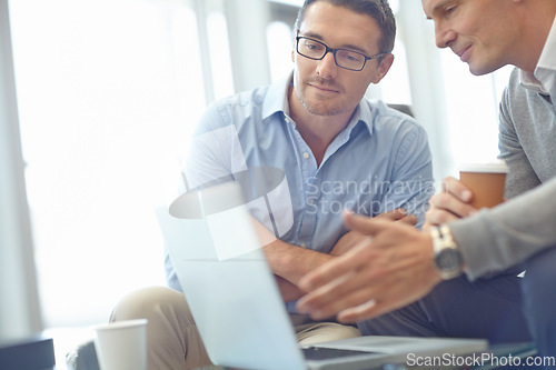 Image of Businessman, laptop and idea strategy in discussion for deal, proposal or corporate idea at the office. Business people sharing ideas, market planning or advertising in conversation at the workplace